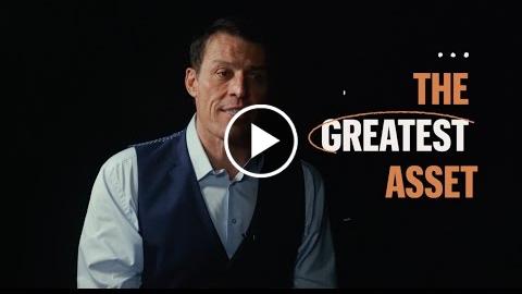 Man in a dark vest and white shirt is speaking against a black background. Text reads "The Greatest Asset" with an orange circle around "Greatest.