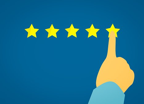 Illustration of a hand pointing at a row of five yellow stars on a blue background, suggesting a five-star rating or review system.