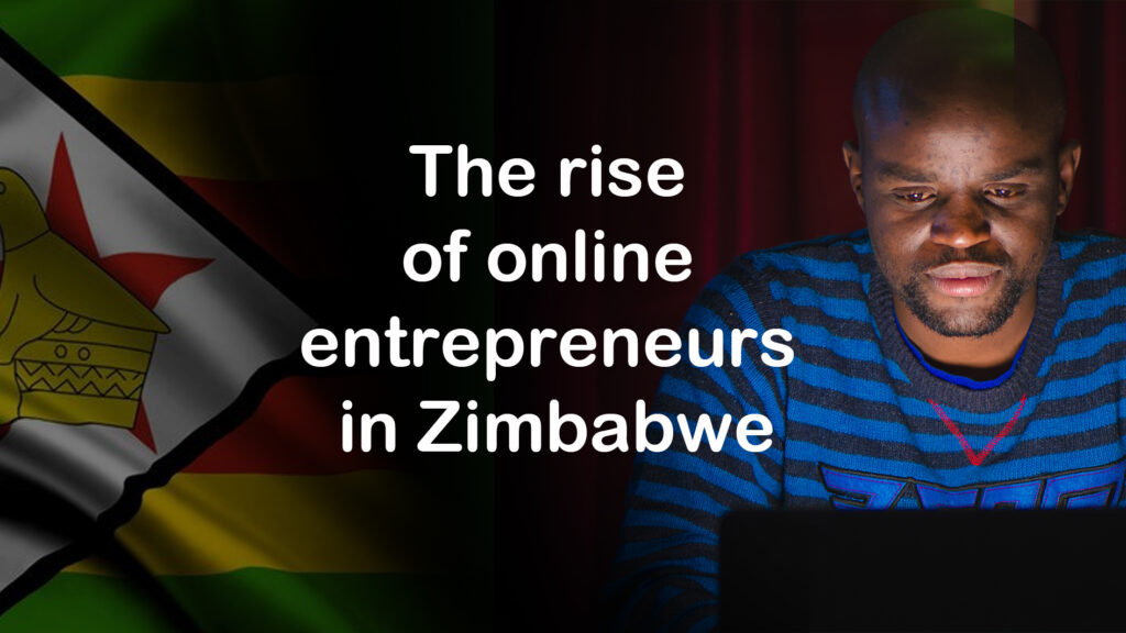 A person wearing a blue and black striped sweater looks at a laptop screen, sitting beside a Zimbabwean flag. The text reads, "The rise of online entrepreneurs in Zimbabwe.
